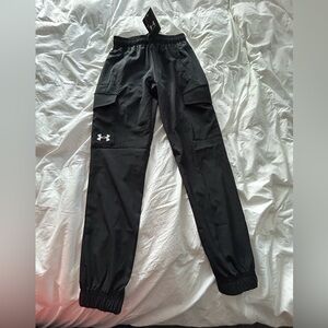 New w tags. Under Armour boys storm joggers YM. Two front and two cargo pockets